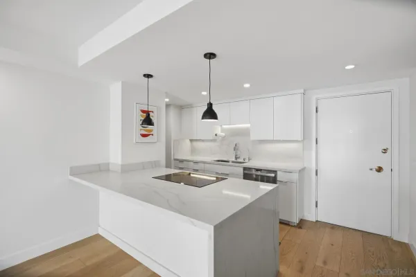 a kitchen with a sink stove and refrigerator