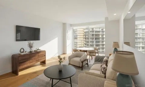 a view of a livingroom with wooden floor and a window