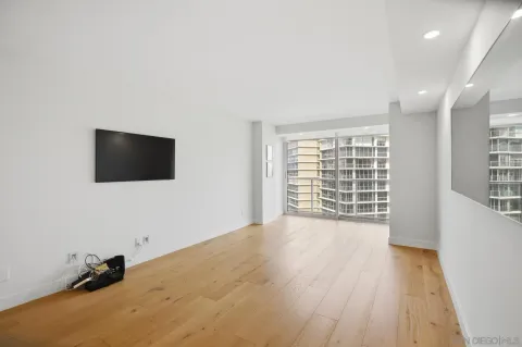 a kitchen with a sink and chairs
