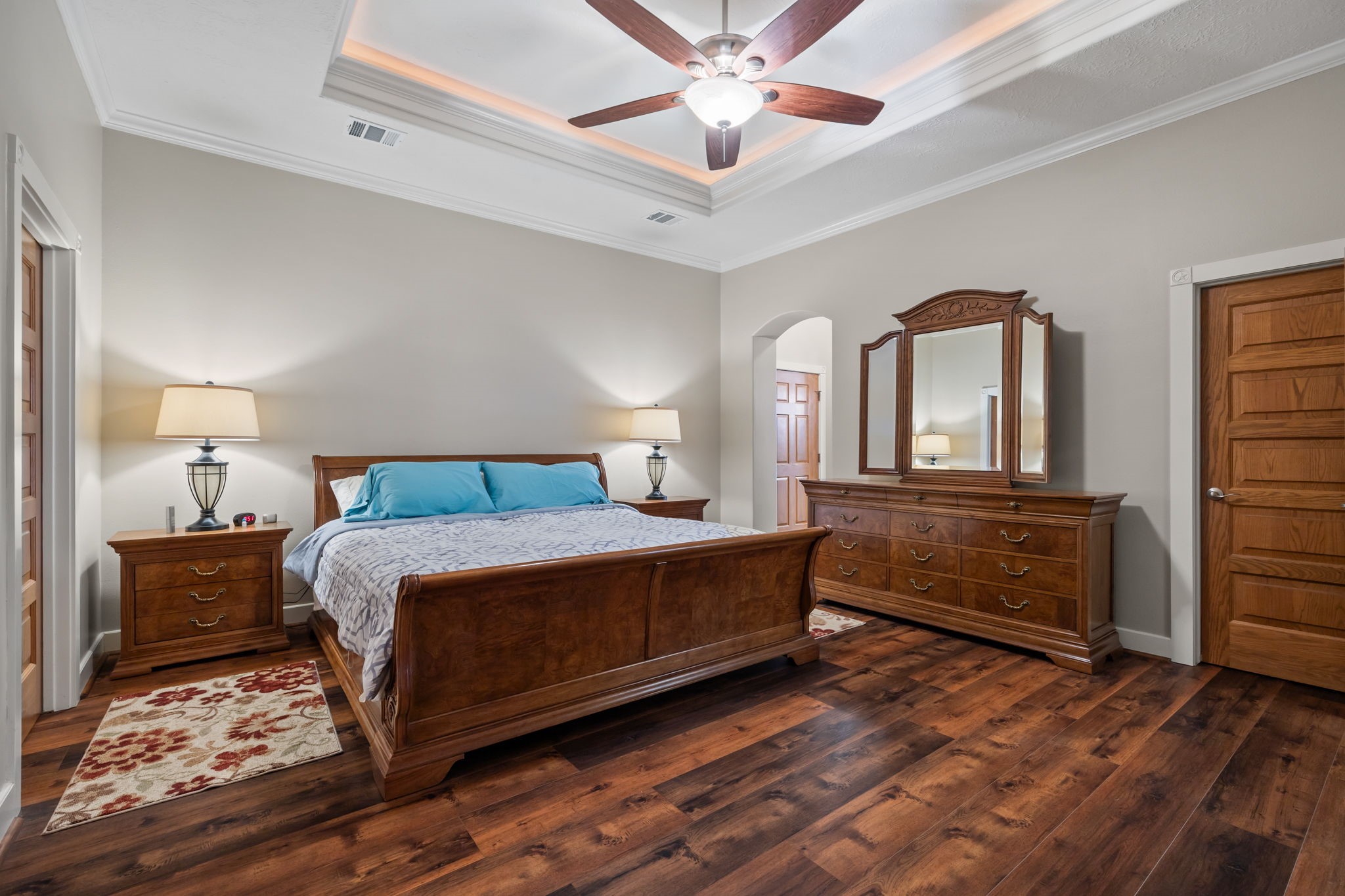 3998 County Road 612 Angleton, TX 77515 - Photo 20 of 47 a bedroom with a bed and a chandelier