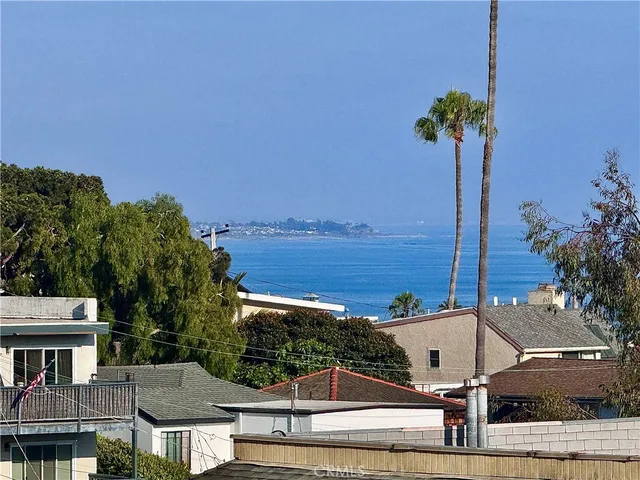a view of a patio with a table and chairs