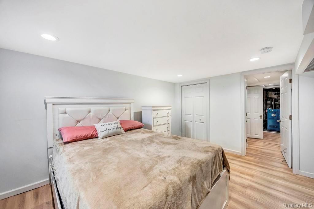 179 Sterling Road Elmont, NY 11003 - Photo 13 of 20 Bedroom with recessed lighting, light wood-style floors, and a closet