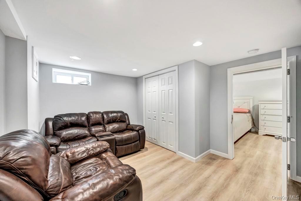 179 Sterling Road Elmont, NY 11003 - Photo 5 of 20 Living room featuring light wood finished floors and recessed lighting