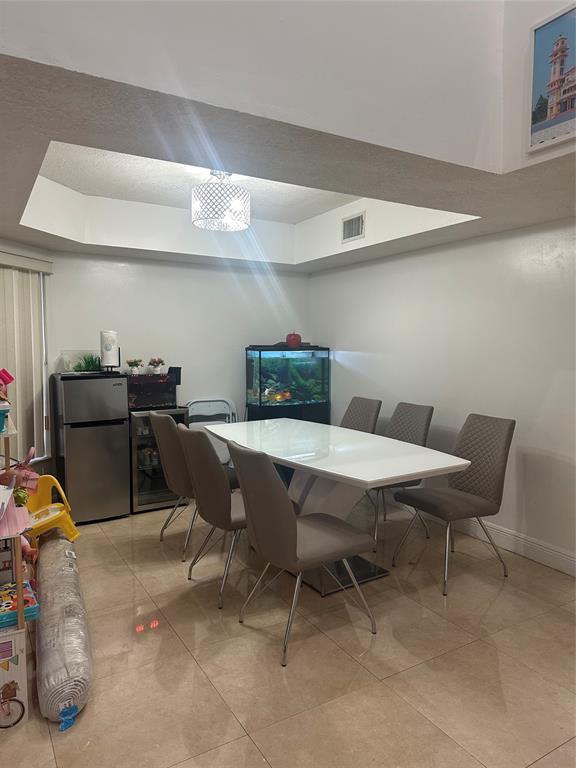 4753 Southwest 154th Court Miami, FL 33185 - Photo 11 of 30 a dining room with furniture and wooden floor