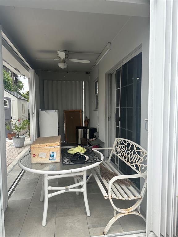 4753 Southwest 154th Court Miami, FL 33185 - Photo 15 of 30 a living room with a couch and a table