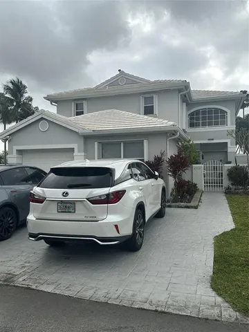 a car parked in front of a house