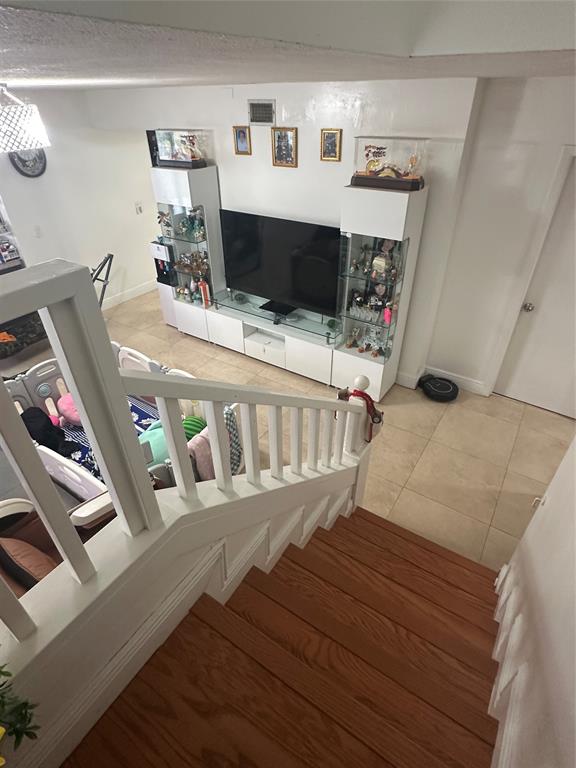 4753 Southwest 154th Court Miami, FL 33185 - Photo 22 of 30 a view of living room with furniture and flat screen tv
