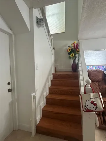 a bed room with a bed and a ceiling fan