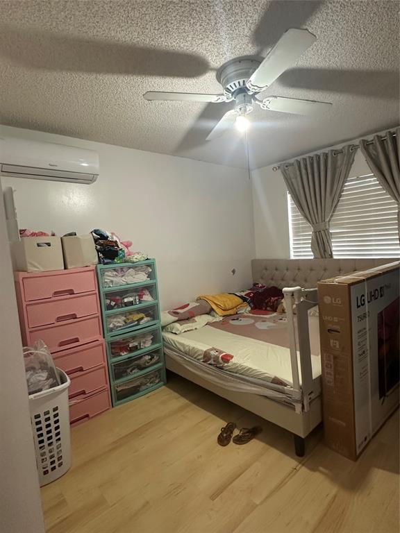 4753 Southwest 154th Court Miami, FL 33185 - Photo 24 of 30 a bed room with a bed and a ceiling fan