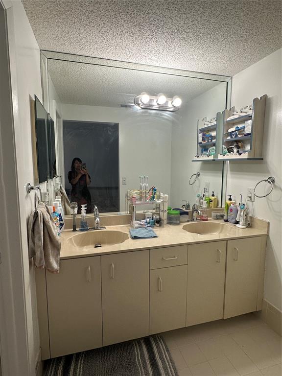 4753 Southwest 154th Court Miami, FL 33185 - Photo 27 of 30 a bathroom with a sink and a mirror