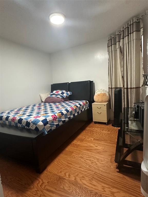 4753 Southwest 154th Court Miami, FL 33185 - Photo 29 of 30 a bedroom with a bed and a chandelier