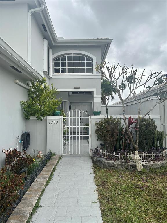 4753 Southwest 154th Court Miami, FL 33185 - Photo 3 of 30 a front view of a house with a garden