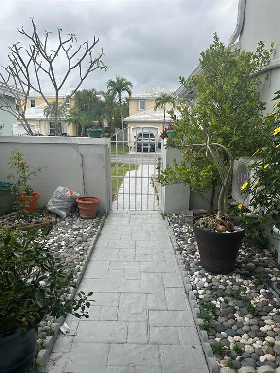 4753 Southwest 154th Court Miami, FL 33185 - Photo 4 of 30 a view of a patio with chair and tables back yard of the house