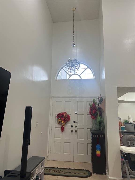4753 Southwest 154th Court Miami, FL 33185 - Photo 9 of 30 a view of a dining room with furniture and chandelier