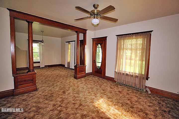 5347 West Richland Road Freeport, IL 61032 - Photo 8 of 20 a view of a big room with windows and chandelier fan