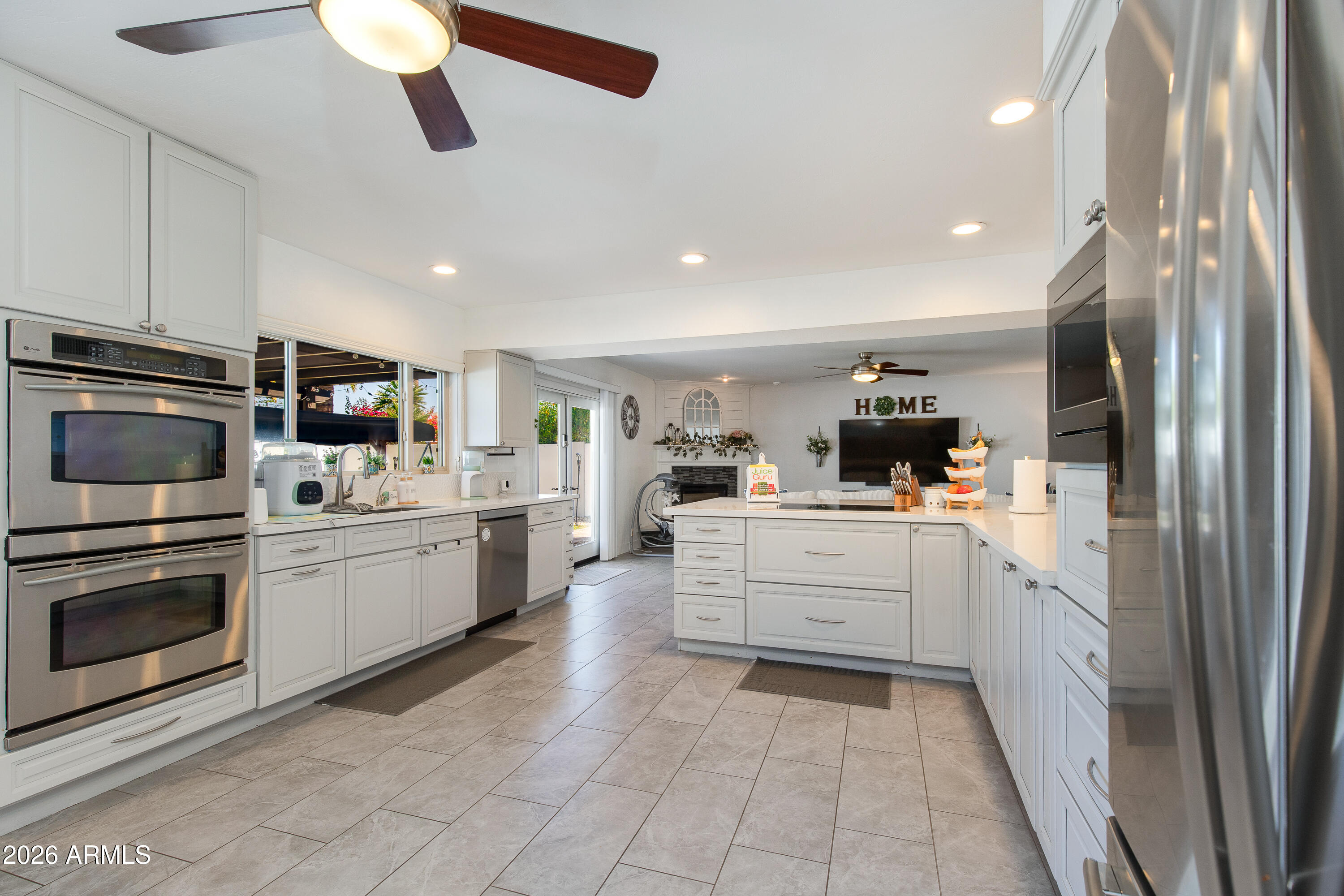 8219 North 3rd Avenue Phoenix, AZ 85021 - Photo 16 of 52 a kitchen with sink cabinets and stainless steel appliances