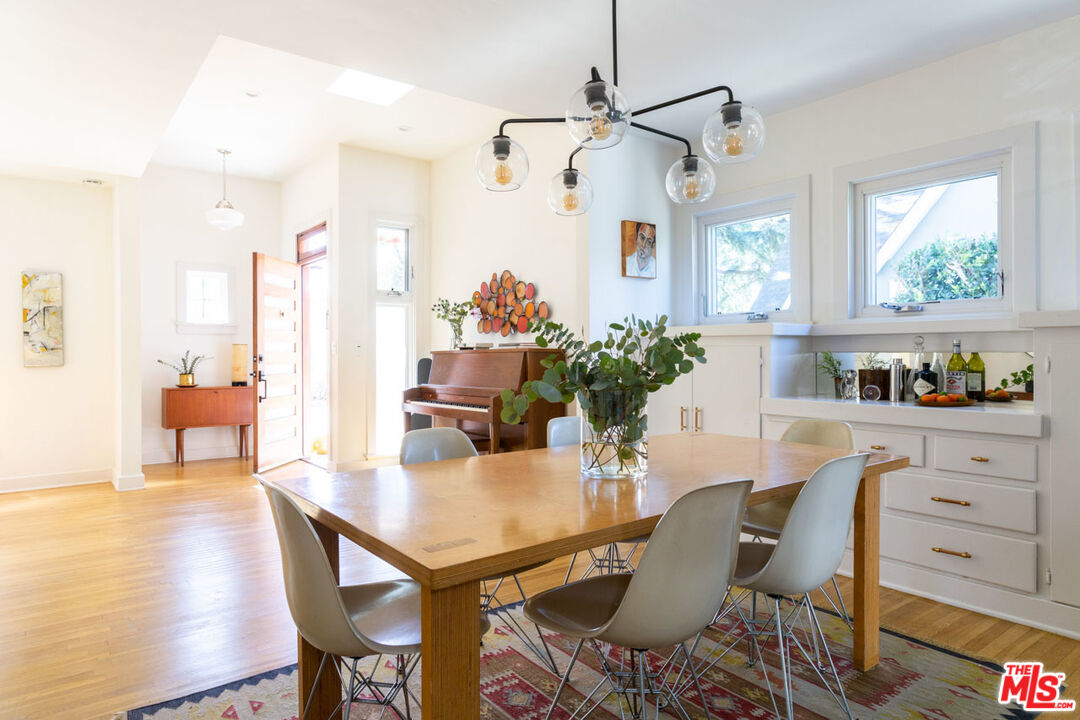 3407 Madera Avenue Los Angeles, CA 90039 - Photo 11 of 46 a view of a dining room with furniture window and wooden floor
