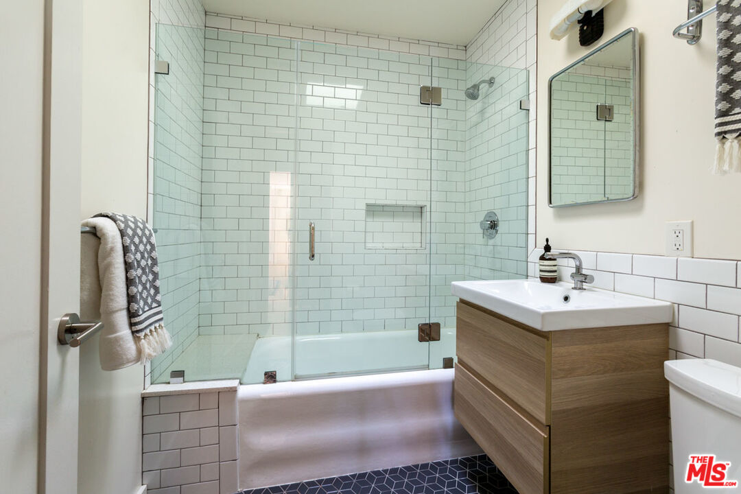 3407 Madera Avenue Los Angeles, CA 90039 - Photo 15 of 46 a bathroom with a sink and mirror