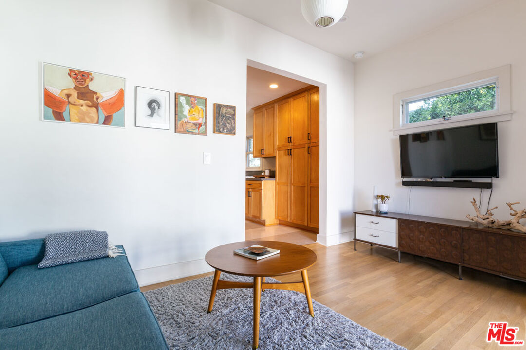 3407 Madera Avenue Los Angeles, CA 90039 - Photo 22 of 46 a living room with furniture and a flat screen tv
