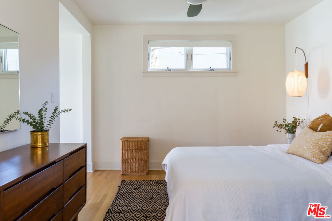3407 Madera Avenue Los Angeles, CA 90039 - Photo 26 of 46 a bedroom with a bed and a potted plant on the dresser