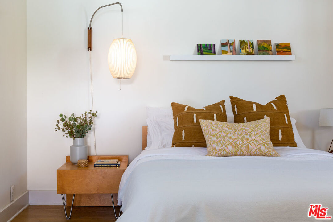 3407 Madera Avenue Los Angeles, CA 90039 - Photo 27 of 46 a bedroom with a bed and a potted plant