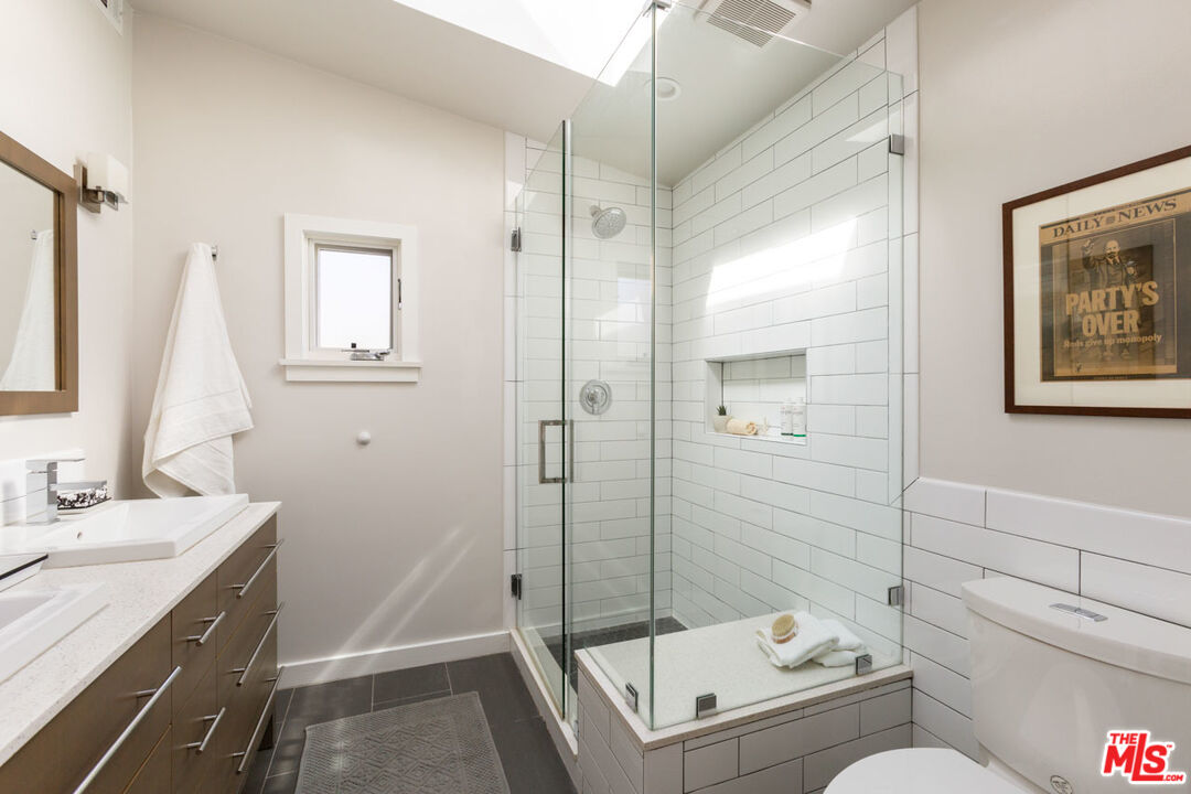 3407 Madera Avenue Los Angeles, CA 90039 - Photo 29 of 46 a bathroom with a sink a toilet and shower