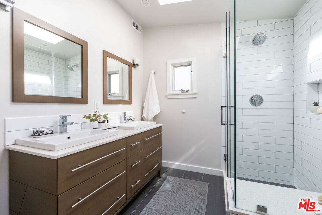 3407 Madera Avenue Los Angeles, CA 90039 - Photo 30 of 46 a bathroom with a sink and a mirror