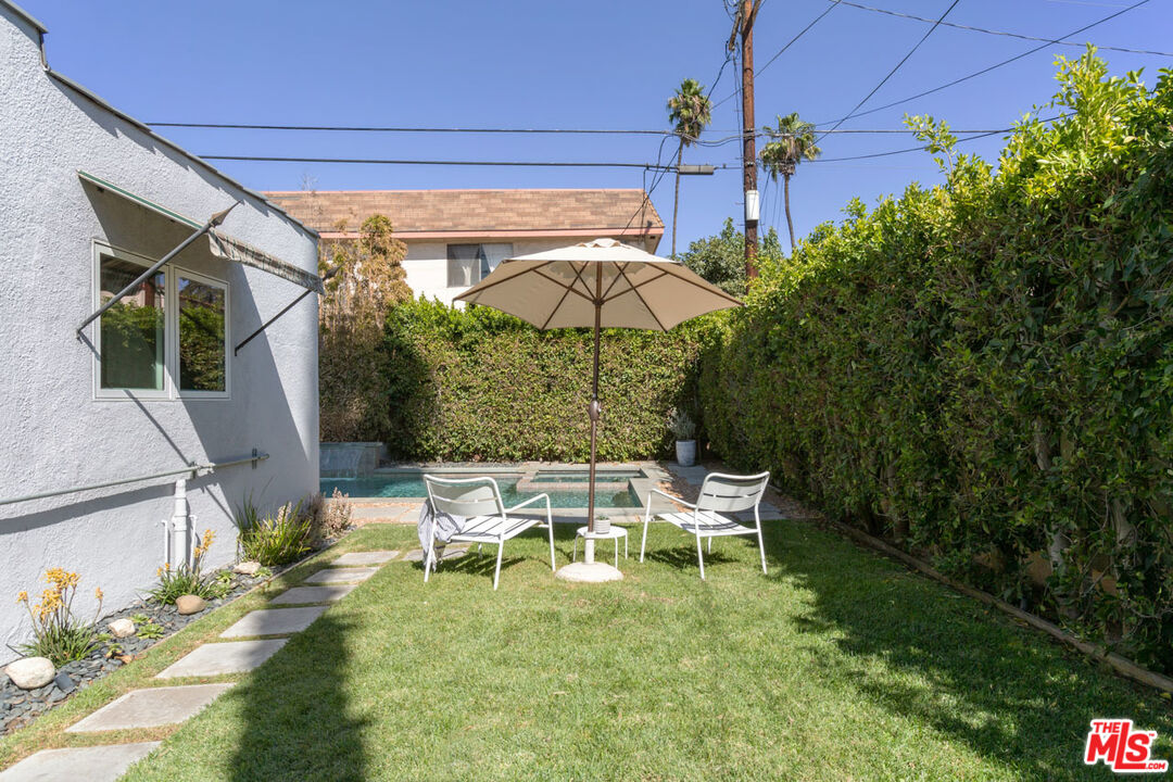 3407 Madera Avenue Los Angeles, CA 90039 - Photo 32 of 46 a view of a patio with table and chairs potted plants