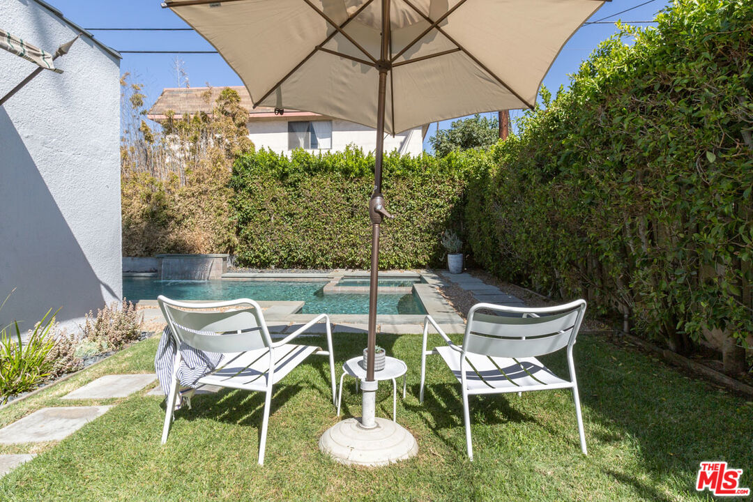 3407 Madera Avenue Los Angeles, CA 90039 - Photo 33 of 46 a patio with a yard table and chairs