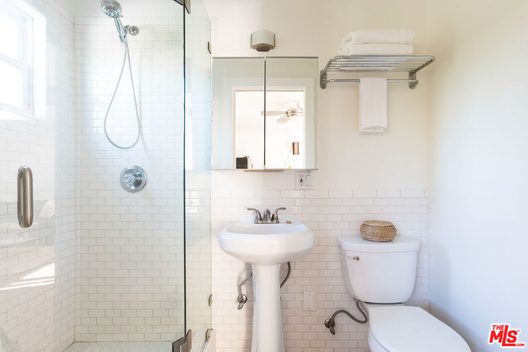 3407 Madera Avenue Los Angeles, CA 90039 - Photo 45 of 46 a bathroom with a sink toilet and shower