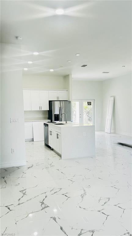 2958 70th Avenue Northeast Naples, FL 34120 - Photo 4 of 8 a view of a kitchen with refrigerator sink and cabinets