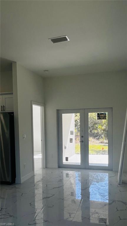 2958 70th Avenue Northeast Naples, FL 34120 - Photo 5 of 8 a view of an empty room with chandelier and a window