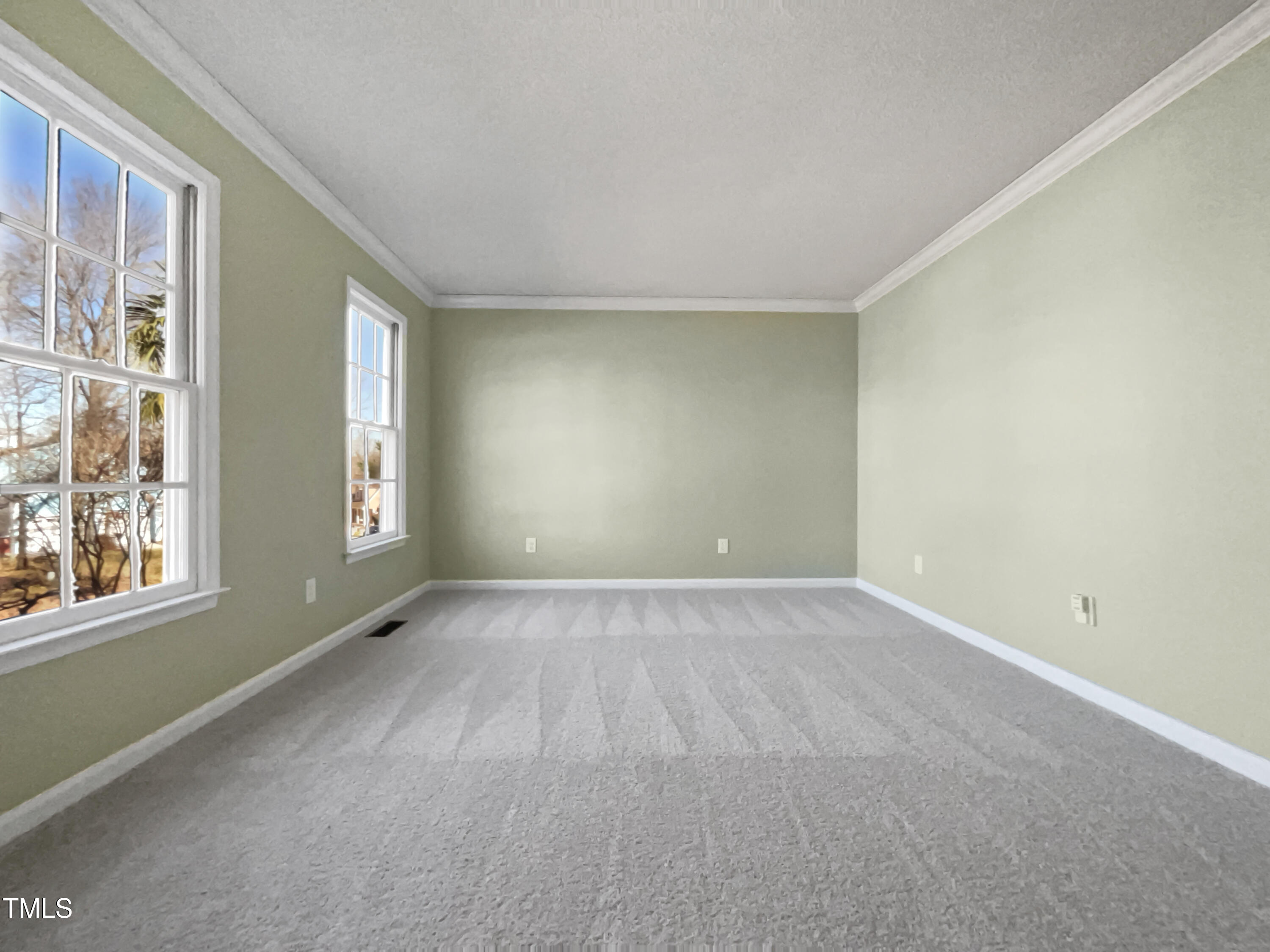 118 Trafalgar Lane Cary, NC 27513 - Photo 11 of 22 an empty room with windows