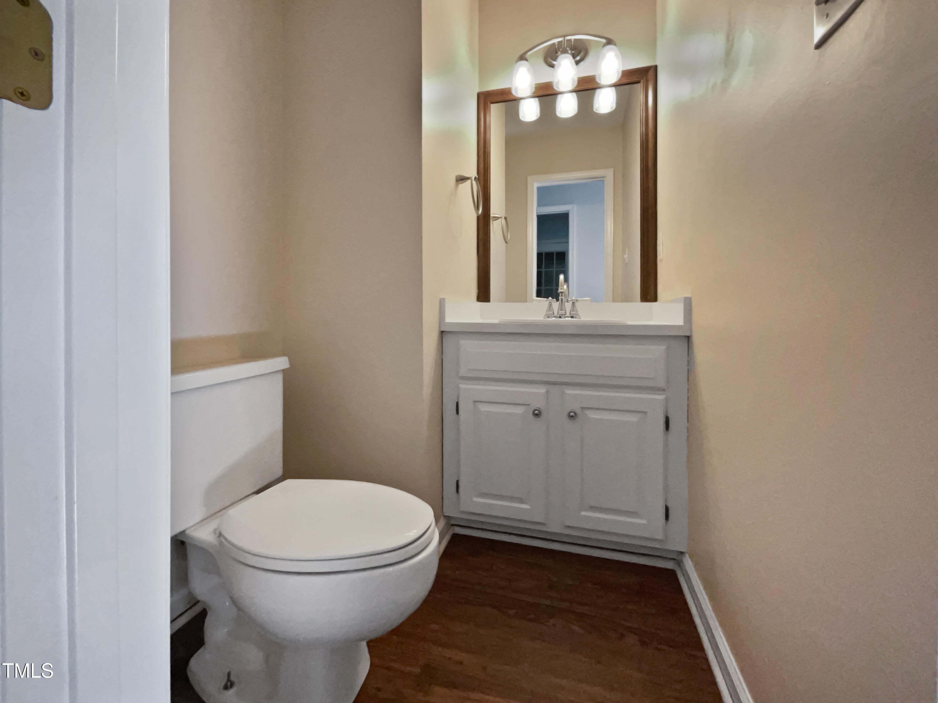 118 Trafalgar Lane Cary, NC 27513 - Photo 13 of 22 a bathroom with a toilet a sink and mirror