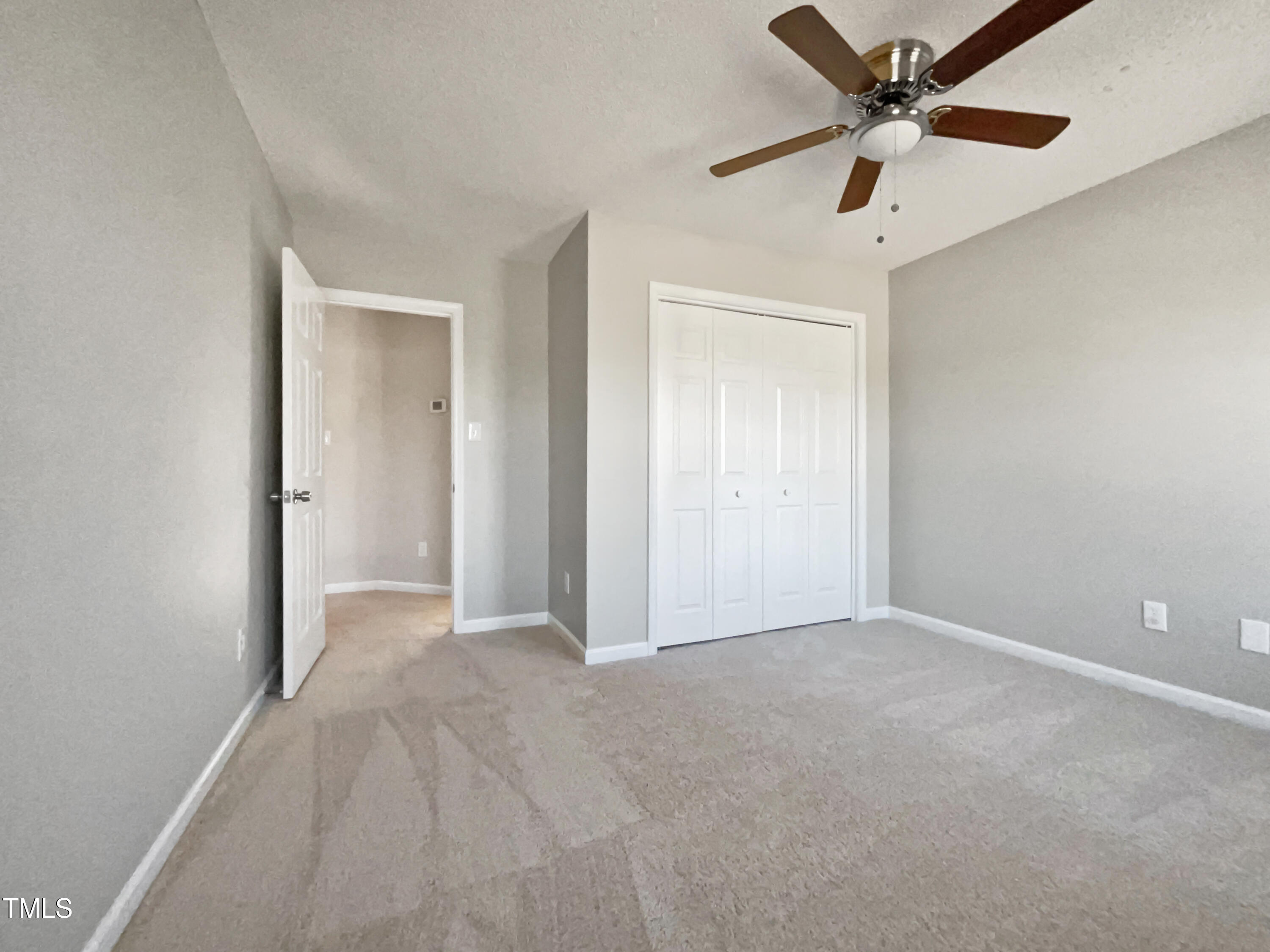 118 Trafalgar Lane Cary, NC 27513 - Photo 15 of 22 an empty room with chandelier fan