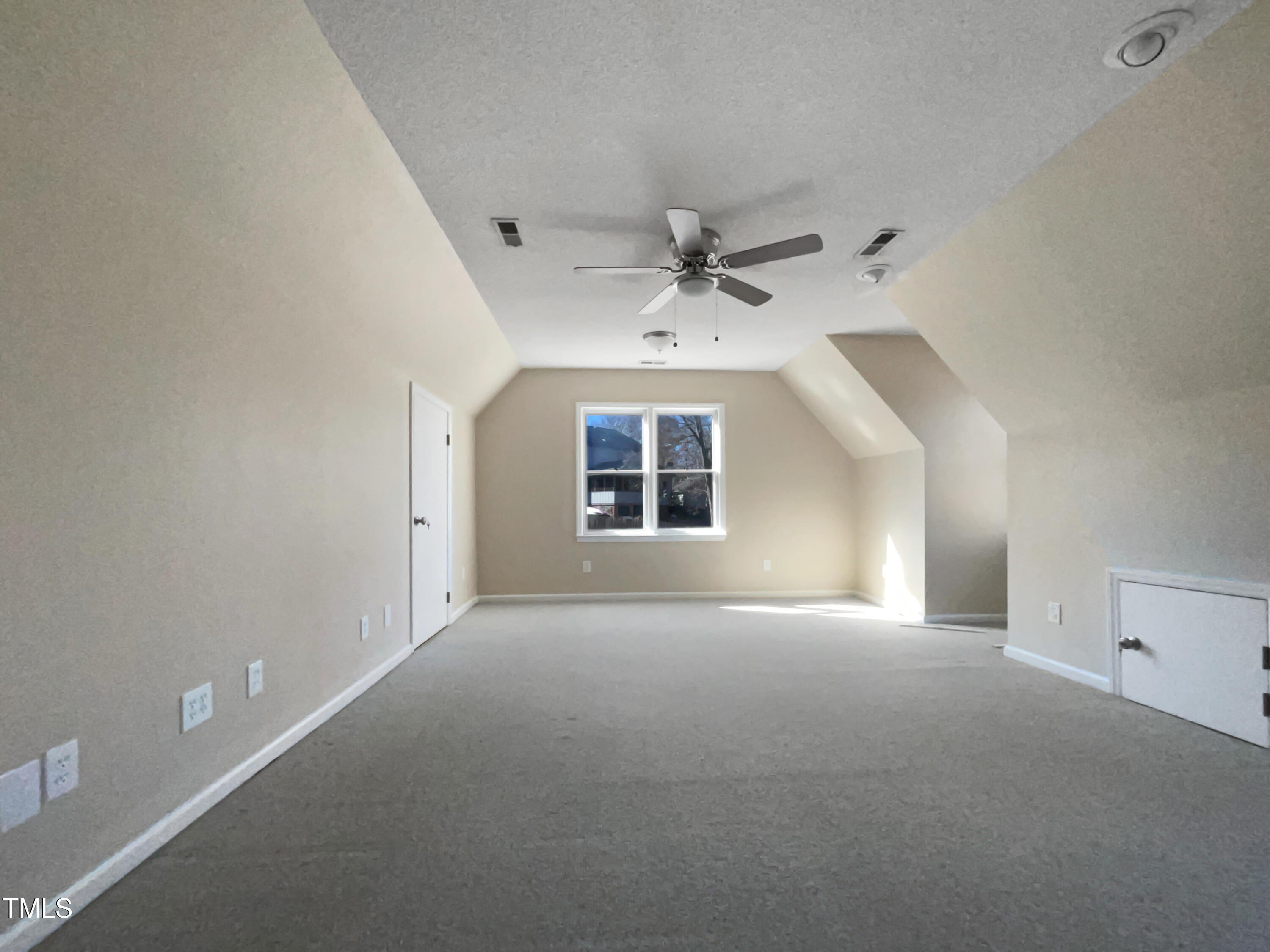 118 Trafalgar Lane Cary, NC 27513 - Photo 16 of 22 an empty room with a ceiling fan and windows
