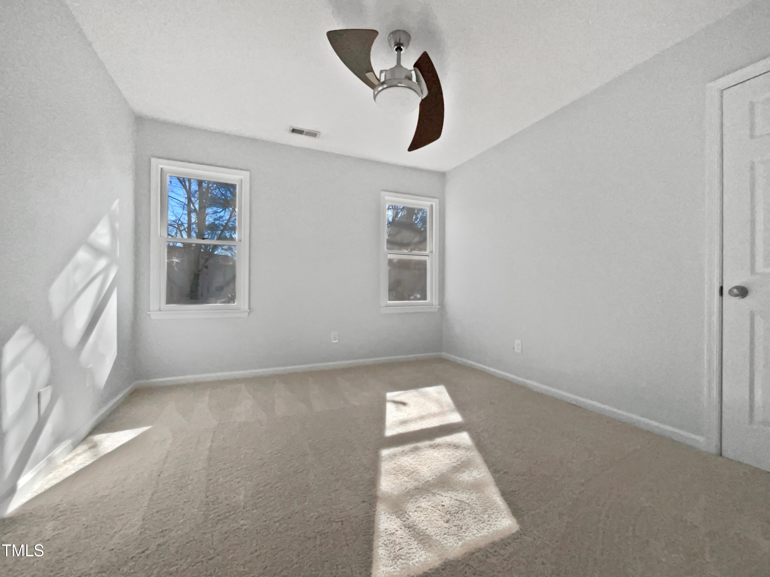 118 Trafalgar Lane Cary, NC 27513 - Photo 18 of 22 a view of an empty room with a window