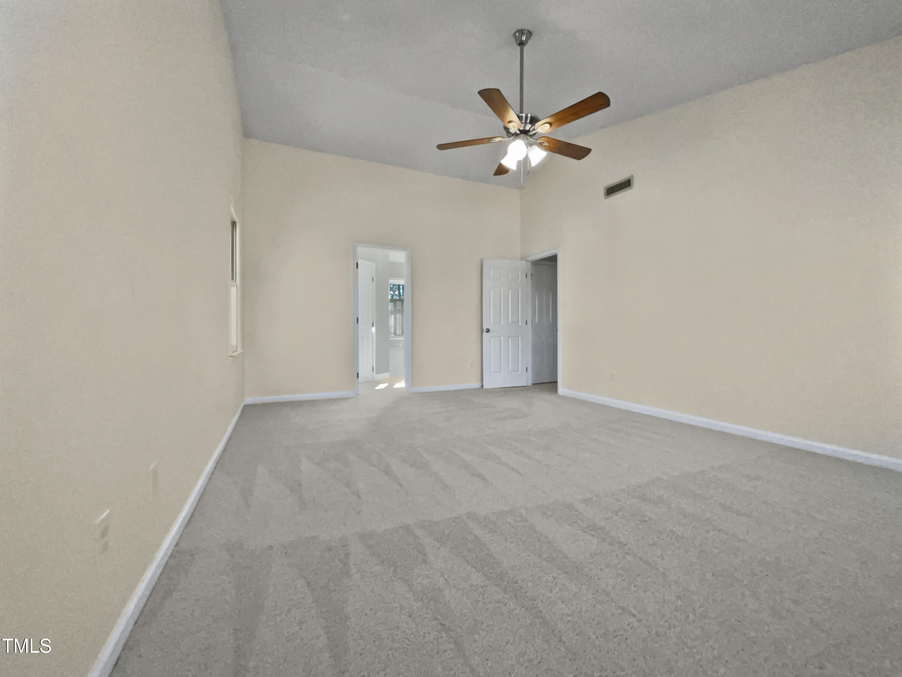 118 Trafalgar Lane Cary, NC 27513 - Photo 9 of 22 a view of an empty room with a chandelier fan