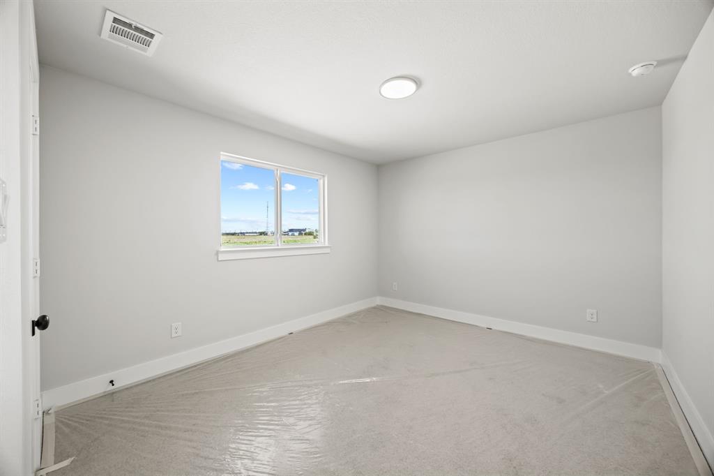 317 Chestnut Street Celina, TX 75009 - Photo 28 of 30 an empty room with a window