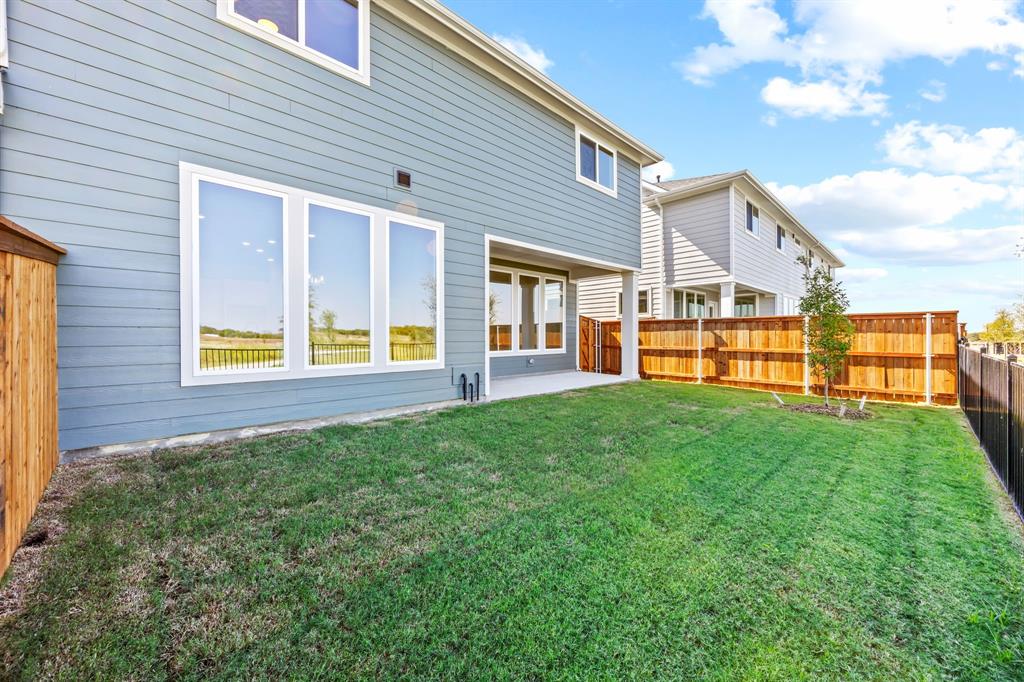 317 Chestnut Street Celina, TX 75009 - Photo 30 of 30 a view of a house with backyard and porch