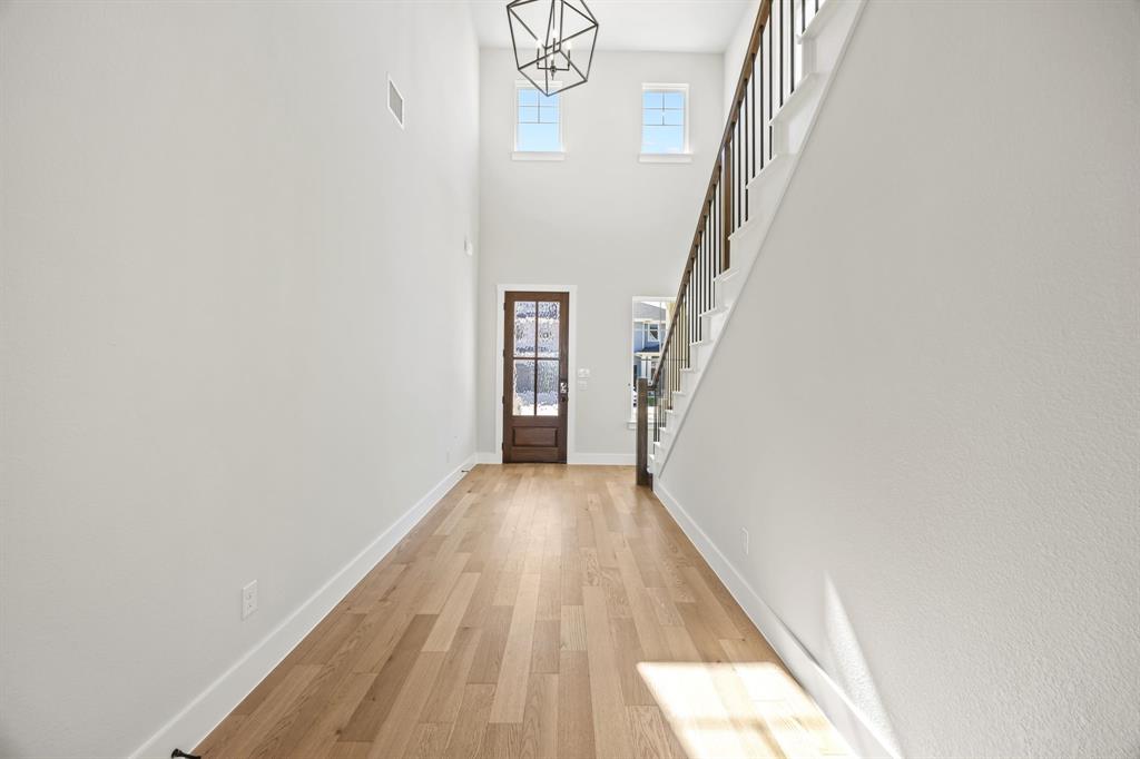 317 Chestnut Street Celina, TX 75009 - Photo 4 of 30 a view of a hallway with wooden floor and entryway