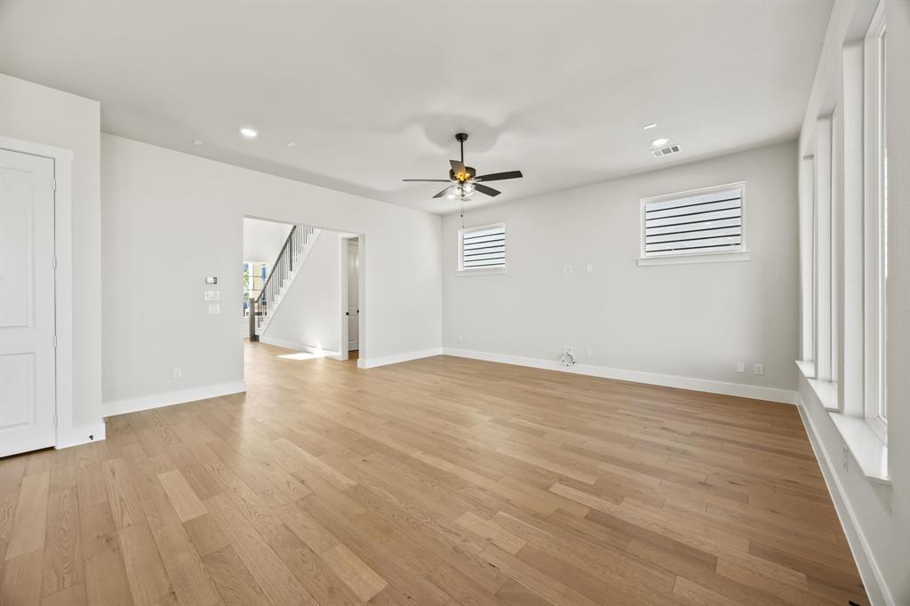 317 Chestnut Street Celina, TX 75009 - Photo 9 of 30 wooden floor in an empty room with a window