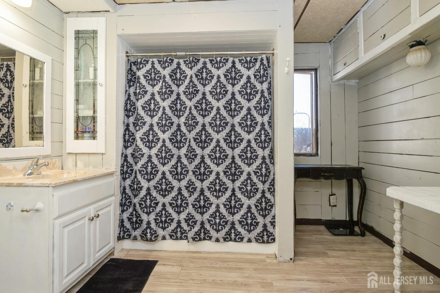 23 Colfax Road Edison, NJ 08817 - Photo 12 of 13 a bathroom with a sink and a mirror