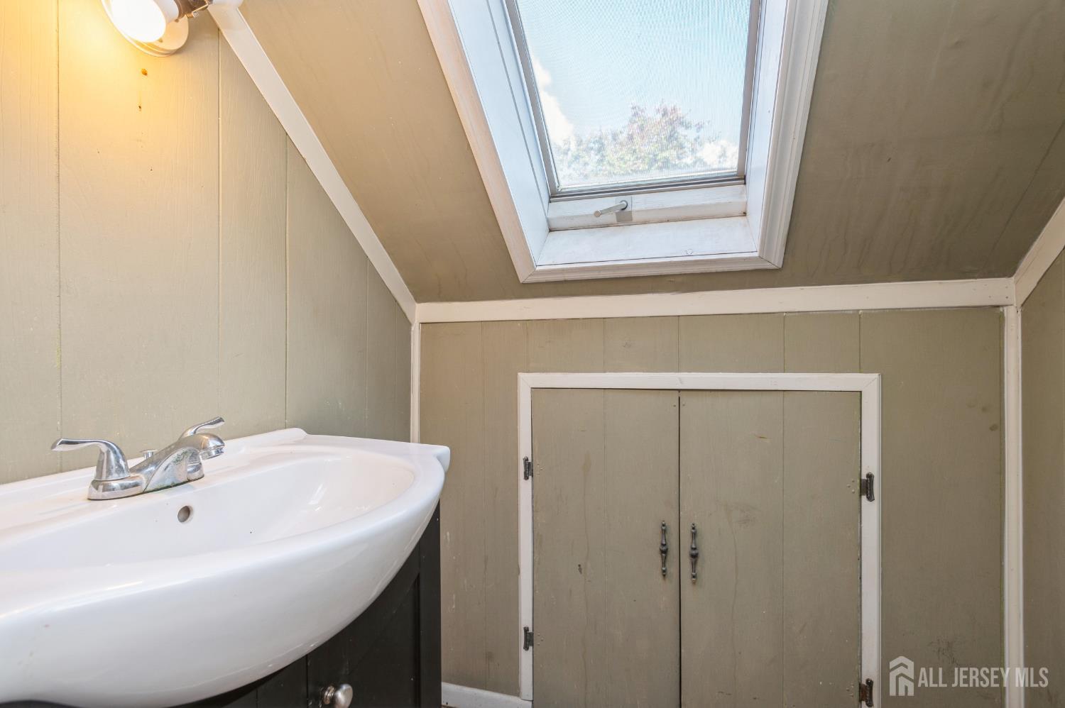 23 Colfax Road Edison, NJ 08817 - Photo 13 of 13 a bathroom with a sink and a mirror