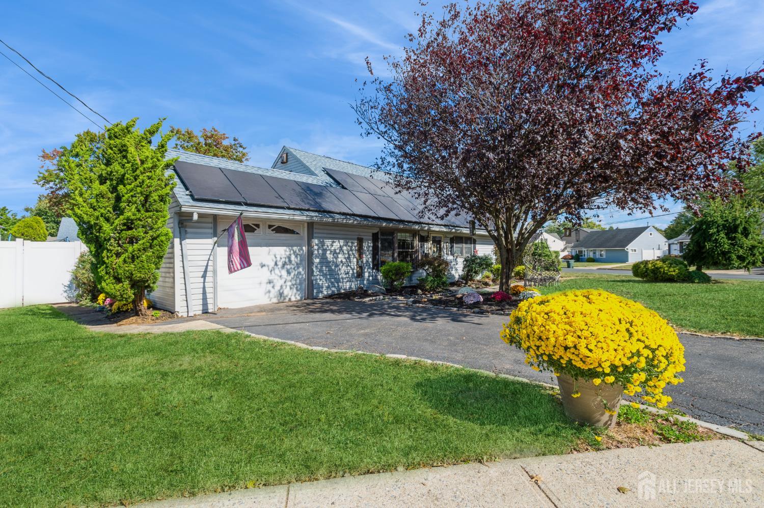 23 Colfax Road Edison, NJ 08817 - Photo 4 of 13 a front view of a house with garden