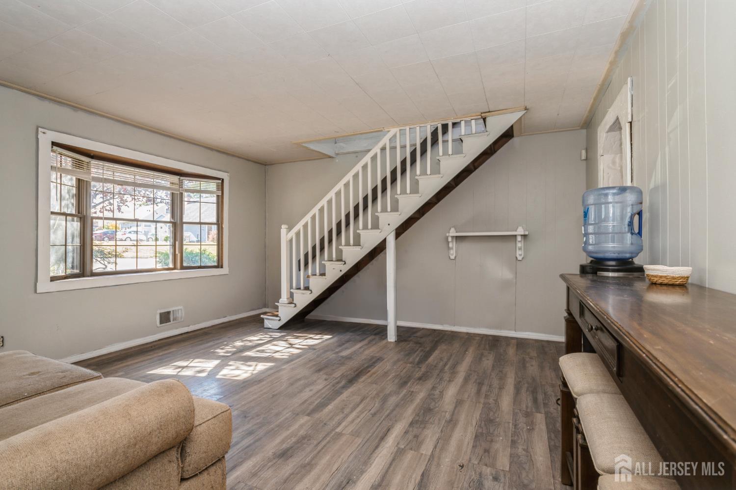 23 Colfax Road Edison, NJ 08817 - Photo 5 of 13 a view of entryway and hall with wooden floor