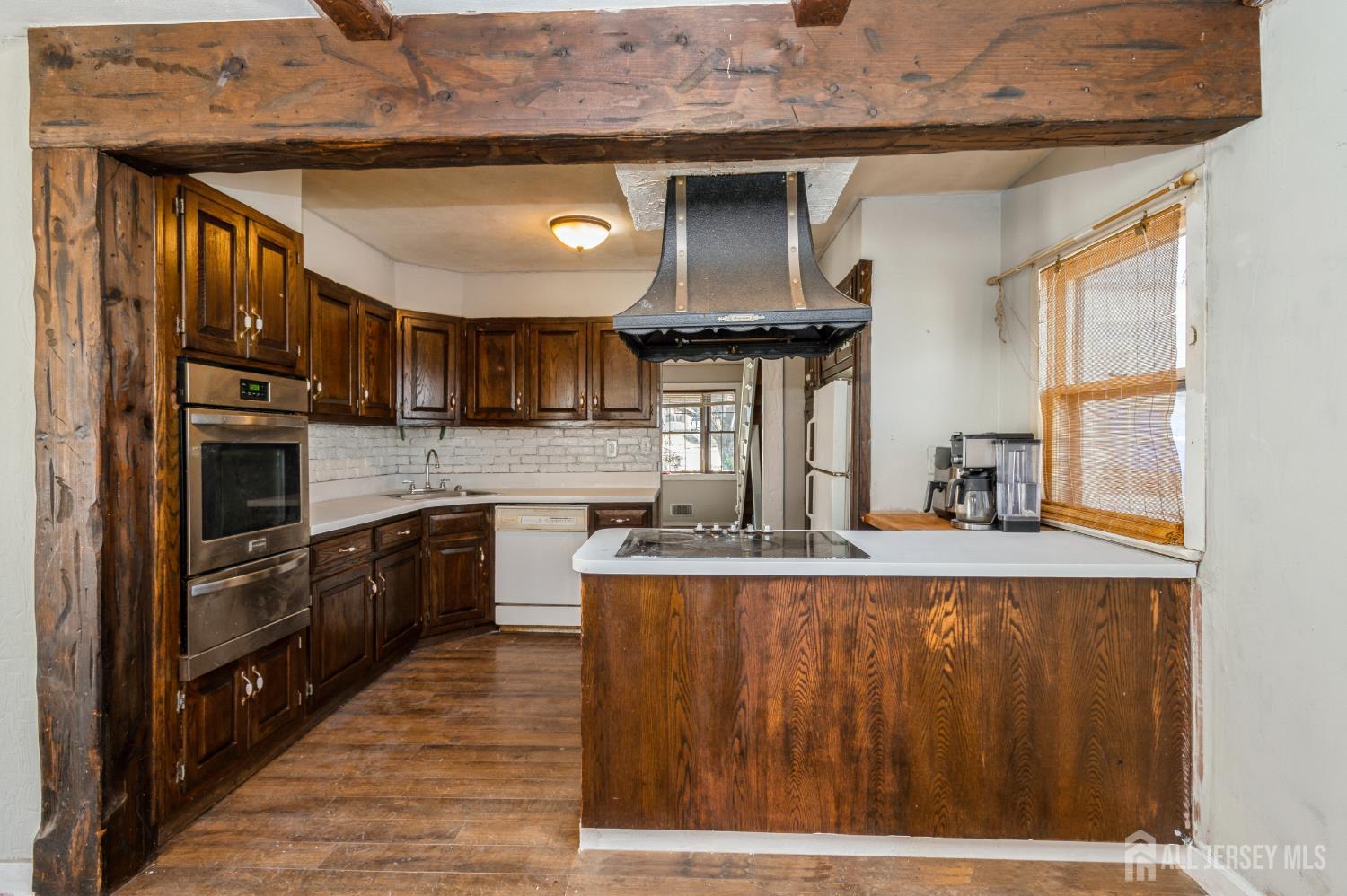 23 Colfax Road Edison, NJ 08817 - Photo 7 of 13 a kitchen with kitchen island granite countertop a stove top oven a sink and dishwasher
