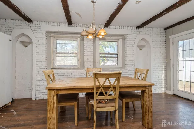 a dining room with furniture and window