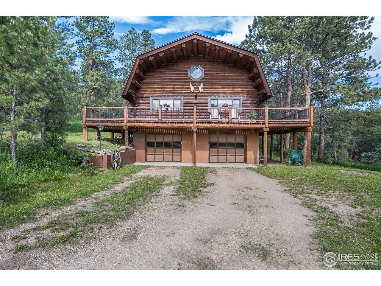 49 Moose Road Lyons, CO 80540 - Photo 12 of 40 a view of a house with a yard and balcony