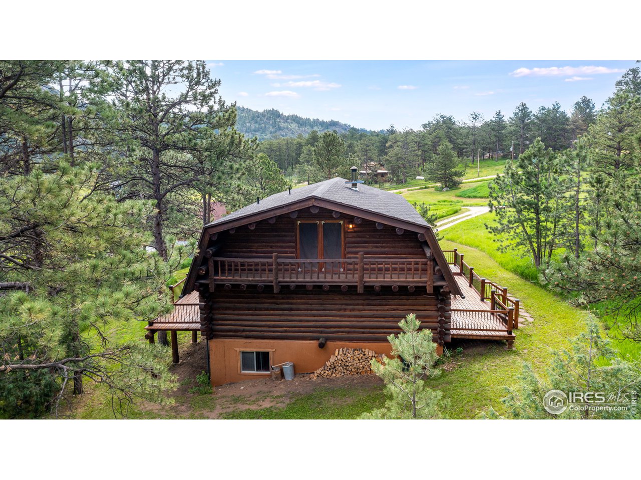49 Moose Road Lyons, CO 80540 - Photo 18 of 40 a view of a house with a yard